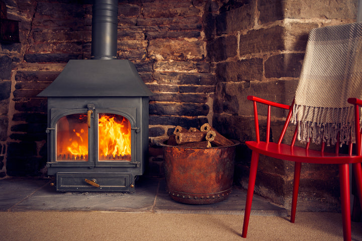 What is the environmental impact of wood-burning stoves?